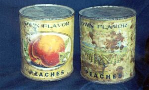 Peach cans with labels recovered during ranch restoration
